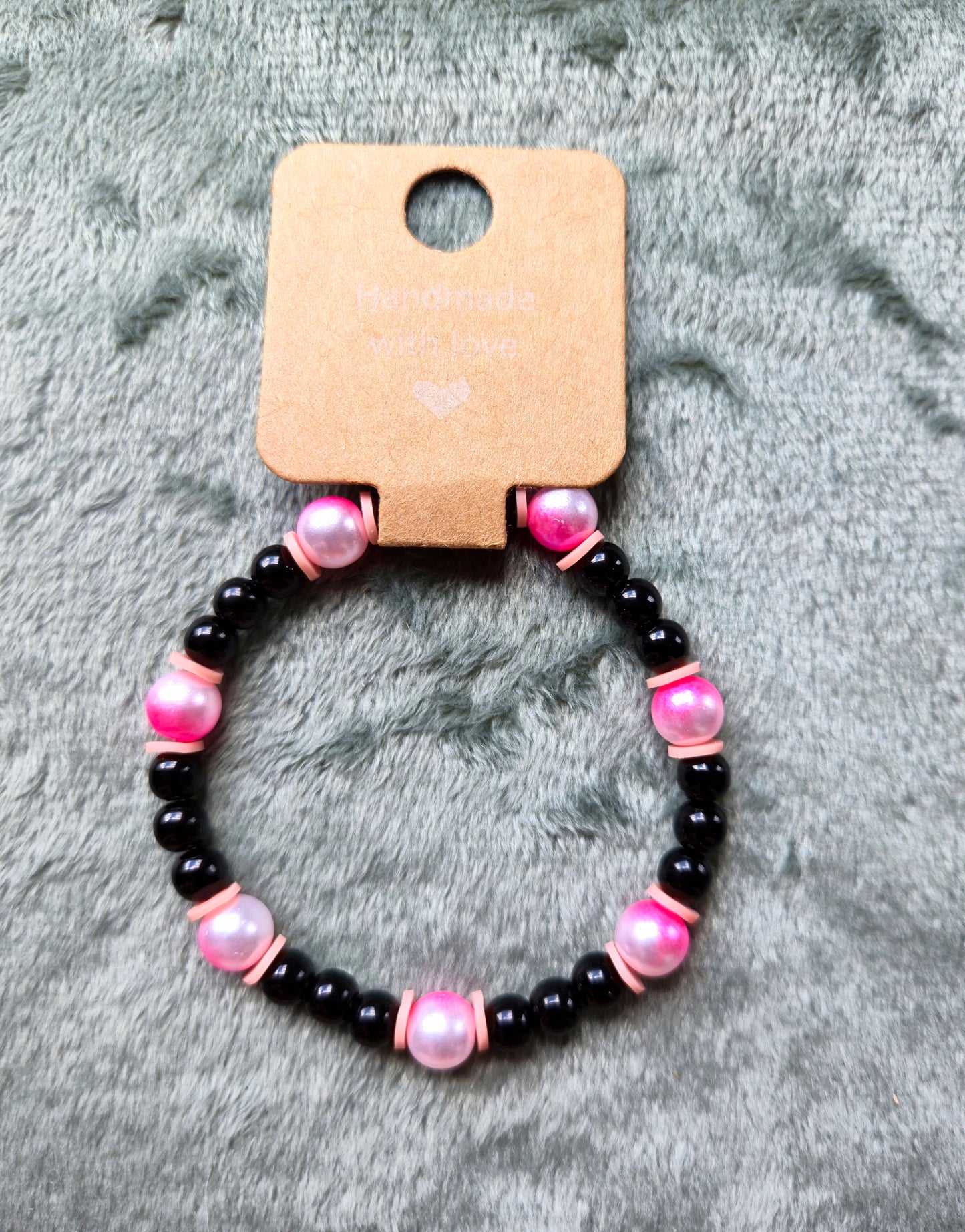 black and pink beaded bracelet