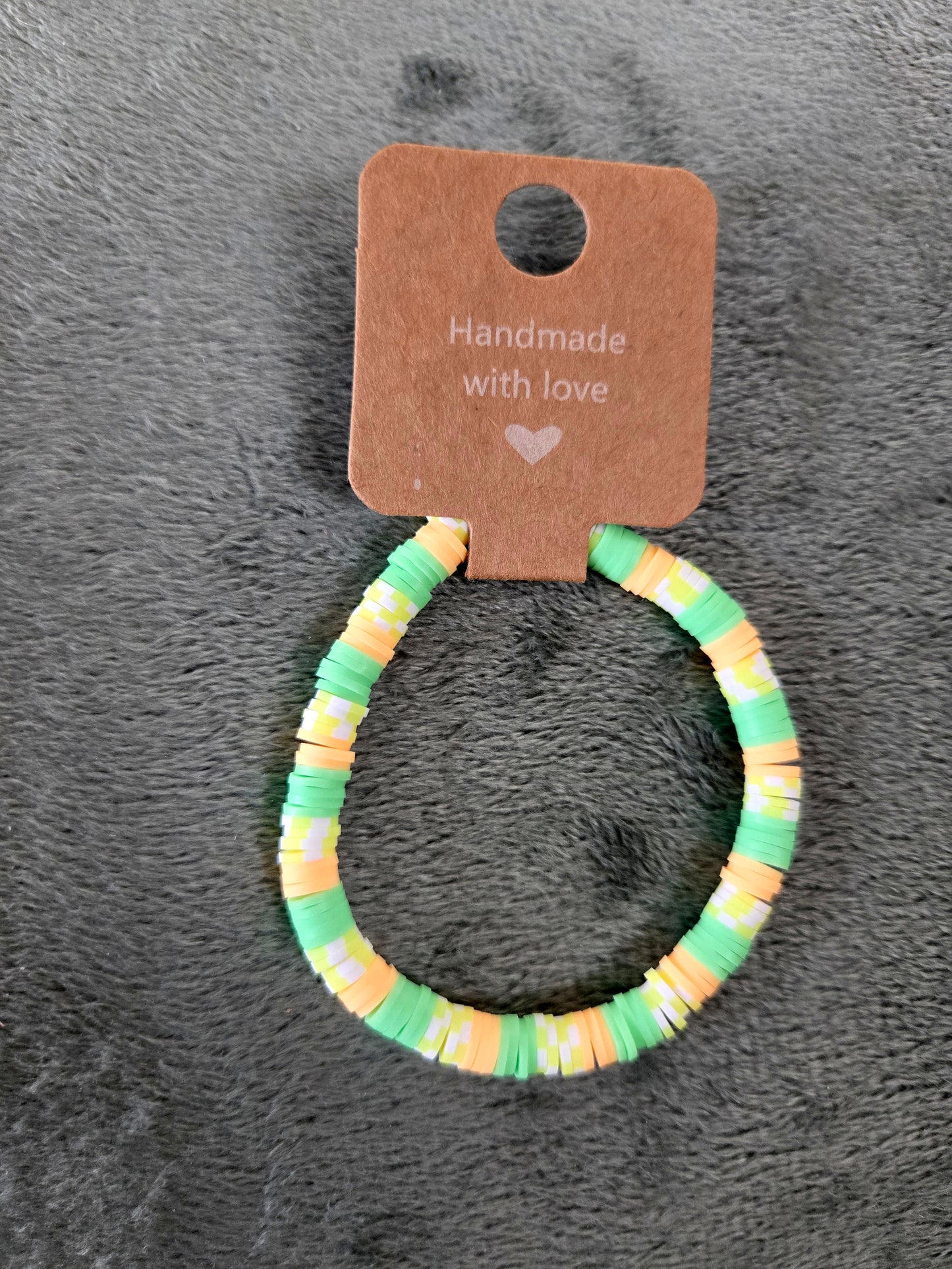Green and orange clay beaded bracelet