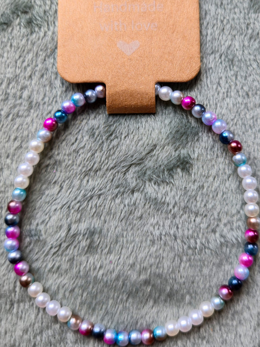Multicolored and white beaded bracelet made with small beads