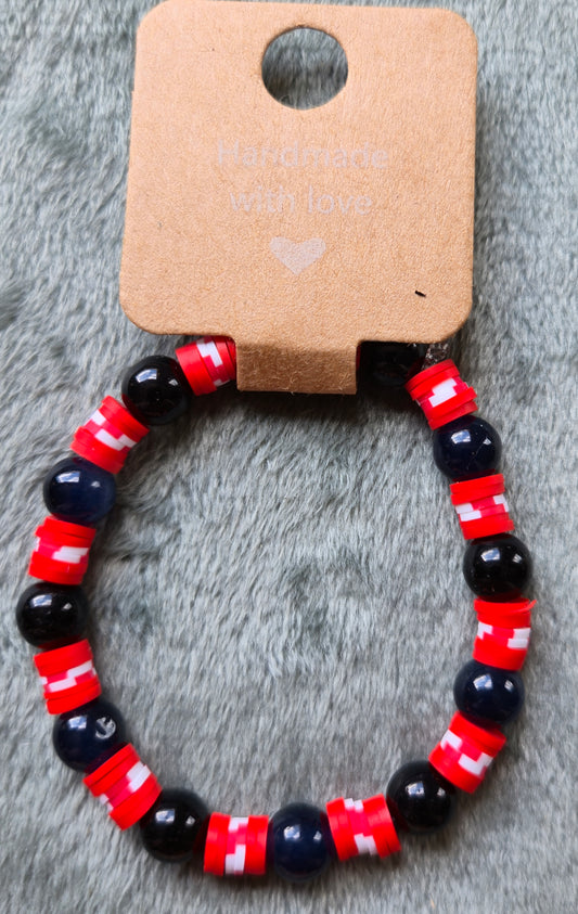 Black and red beaded bracelet with hints of white