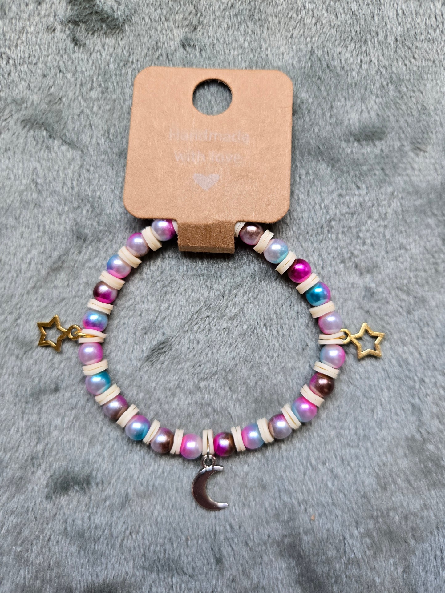Multicolored beaded bracelet with moon and star charms