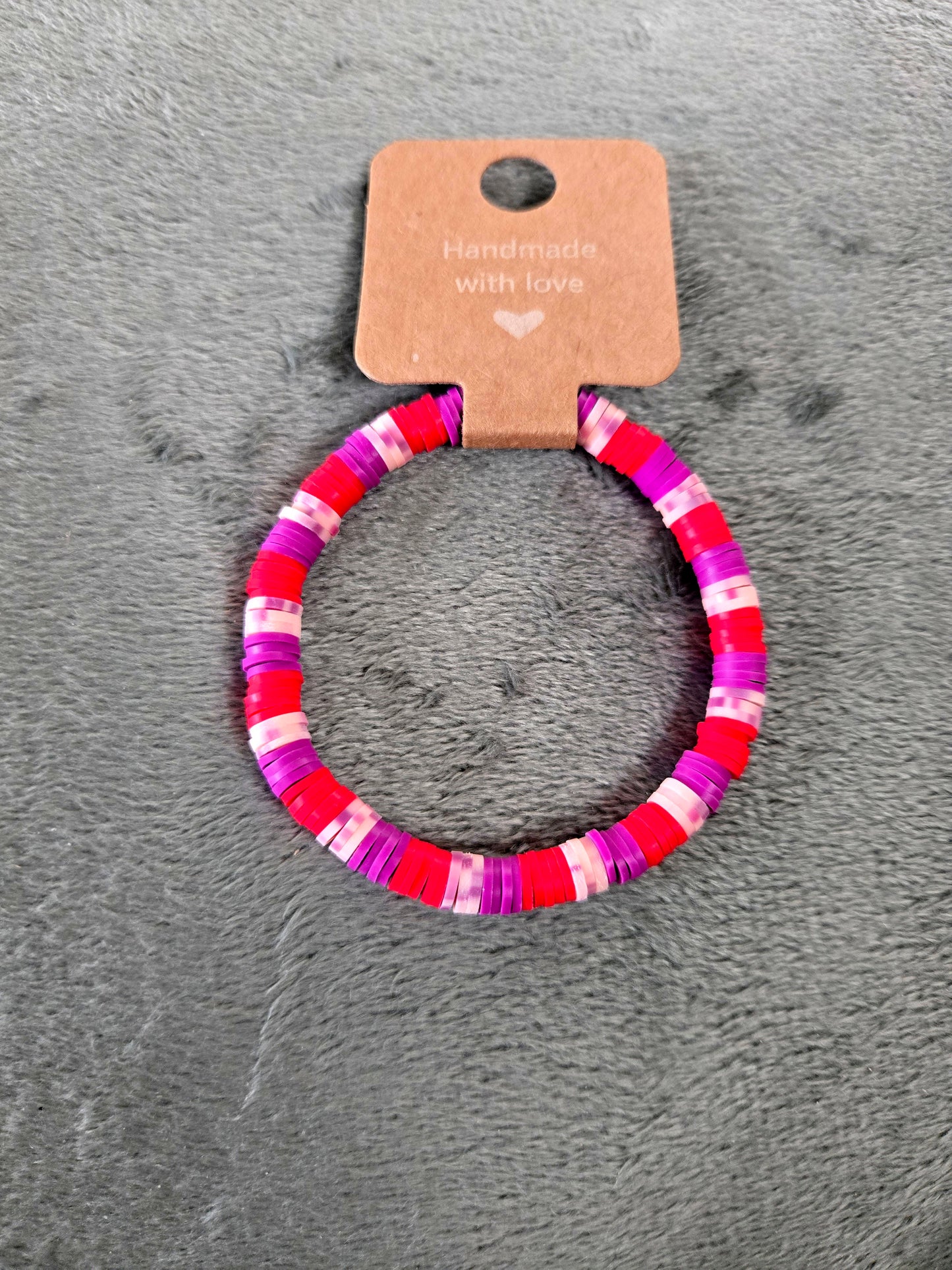 Red, purple and pink clay beaded bracelet