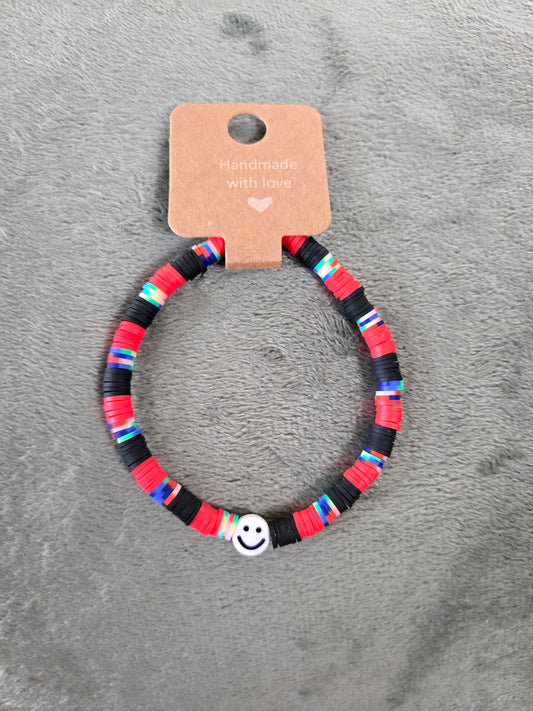 Black and red clay beaded bracelet with a smiley face