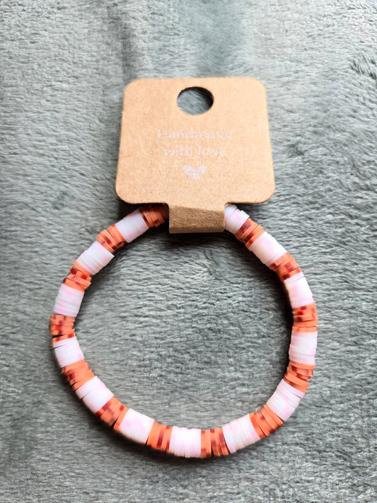 Orange and white clay beaded bracelet