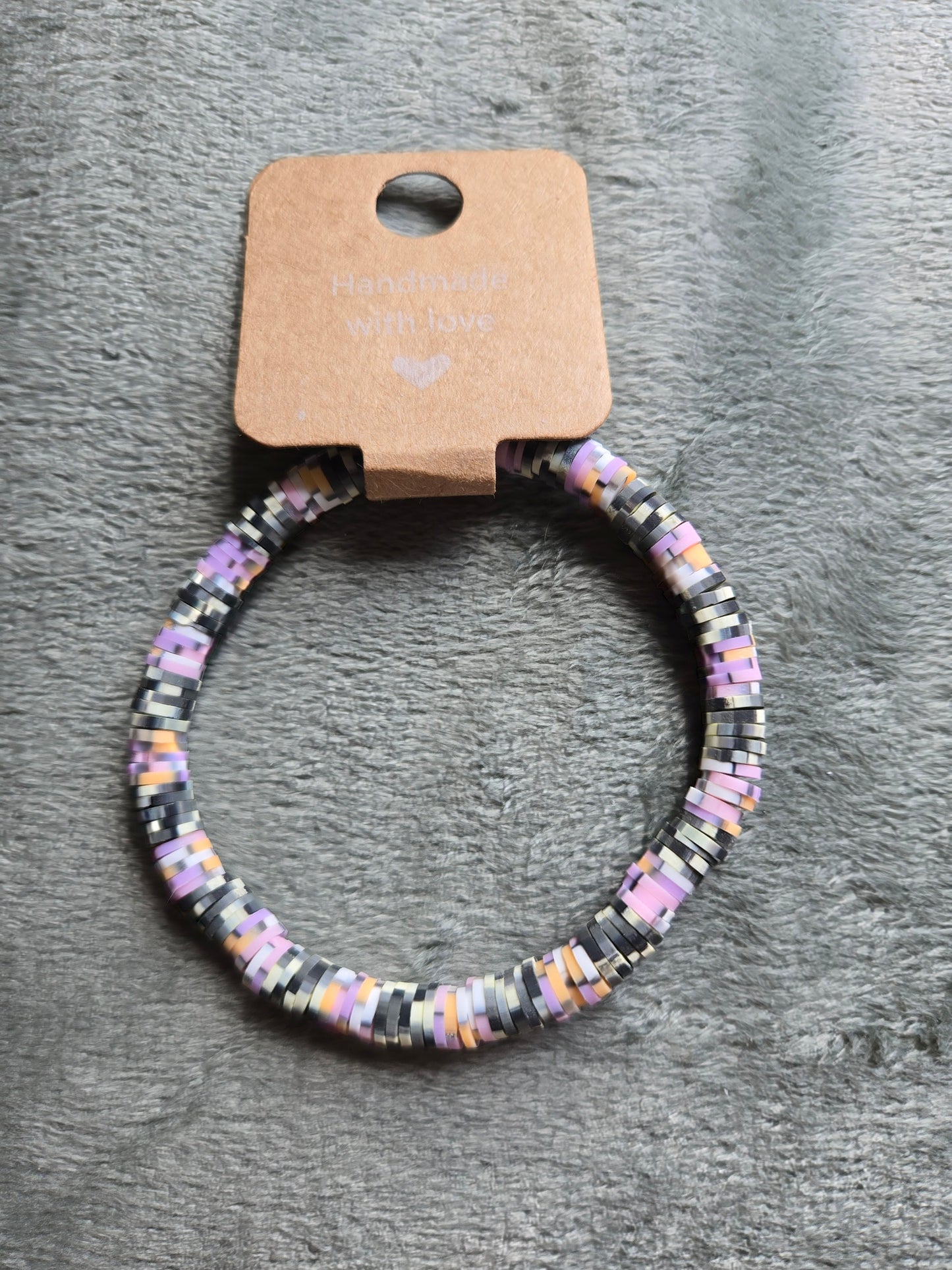 Black, white and multicolored clay beaded bracelet