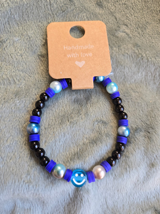 Black and blue beaded bracelet with smiley face